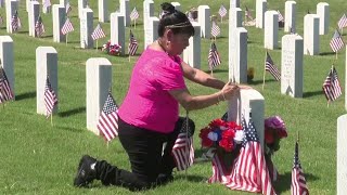 Families pay respect to loved ones at Fort Sam Houston Cemetery on Memorial Day weekend