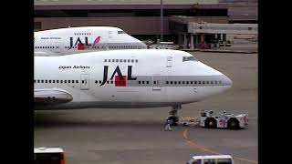 Japan Airlines Boeing 747-200s pushed off gates at Tokyo