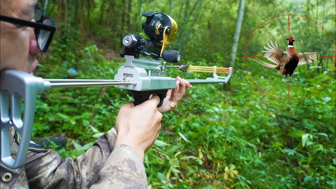 Fishing with mechanical slingshot rifle and darts. 