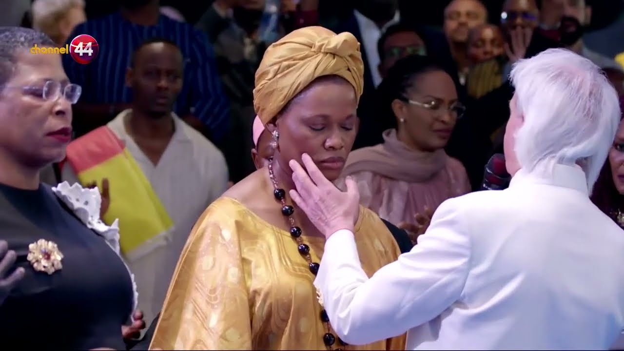 Pastor Benny Hinn prays and blesses Her R Highness Queen Sylvia Nagginda, and the Speaker