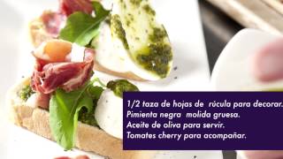 Crostini de mozzarella de búfala, jamón serrano y pesto de rúcula con almendras tostadas