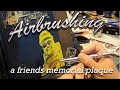 Airbrushing a Friends Memorial Plaque.