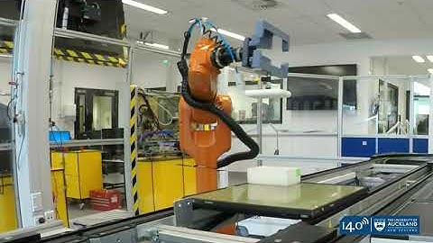 Automated manufacturing assembly line with dual KUKA robots