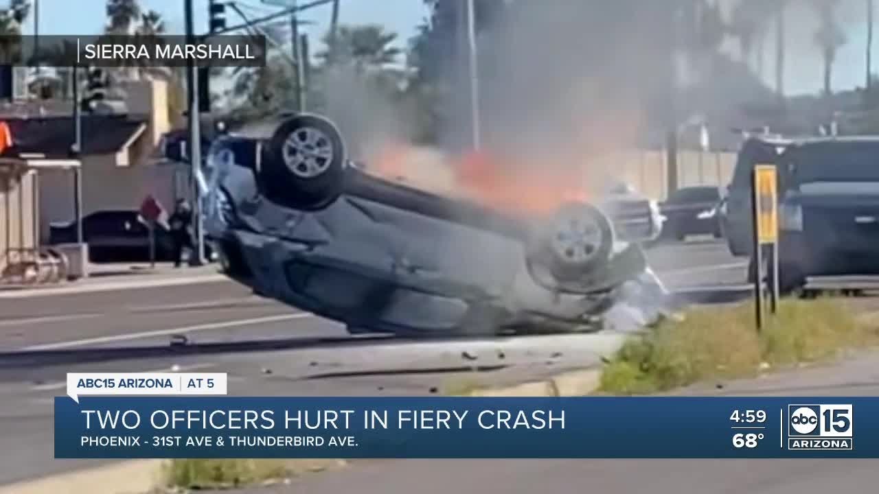 Two officers hurt in fiery crash - YouTube