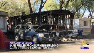 Neighbor jumps into action, saving life in a fire at Colorado Springs mobile home park