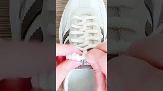 Creative White Sneaker with Black Stripes Design