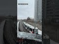 Video shows sparks flying where stopped LRT train meets overhead wire