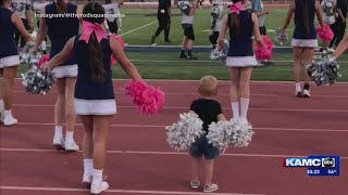 Tiny tot cheerleader wows the crowd