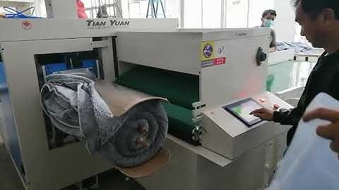 Blankets rolling packing machine, comforter rolling machine, comforter packing machine