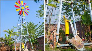 Aermotor Windmill Pumping Air Into A Stock Tank