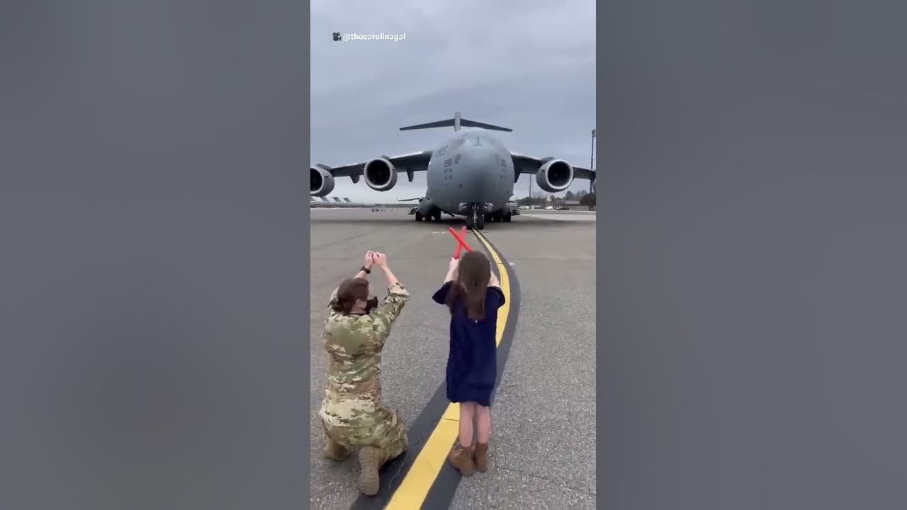 After 20 years of service, little girl marshals her dad in on his last flight
