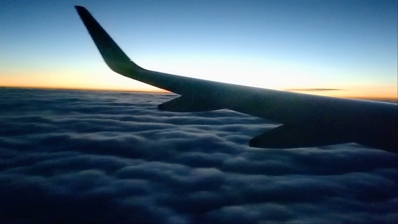 Early morning sky view from plane. | Travellers and Foodies