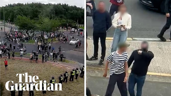Asylum seekers film rioters making threatening gestures as they surround Rotherham hotel