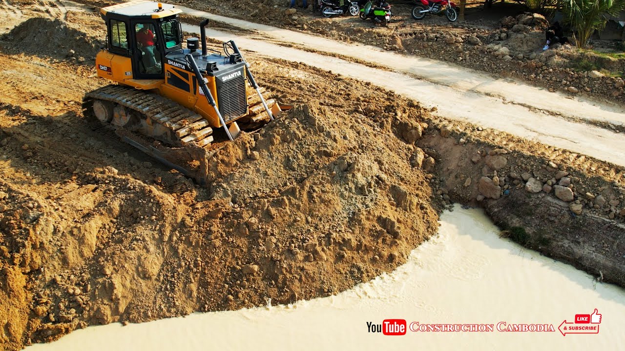 Shows Fill Up Land Best Shantui DH17c3 Bulldozer pushing soils into water with Dump Trucks Unloading