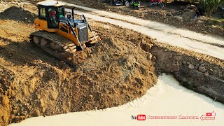 Shows Fill Up Land Best Shantui DH17c3 Bulldozer pushing soils into water with Dump Trucks Unloading