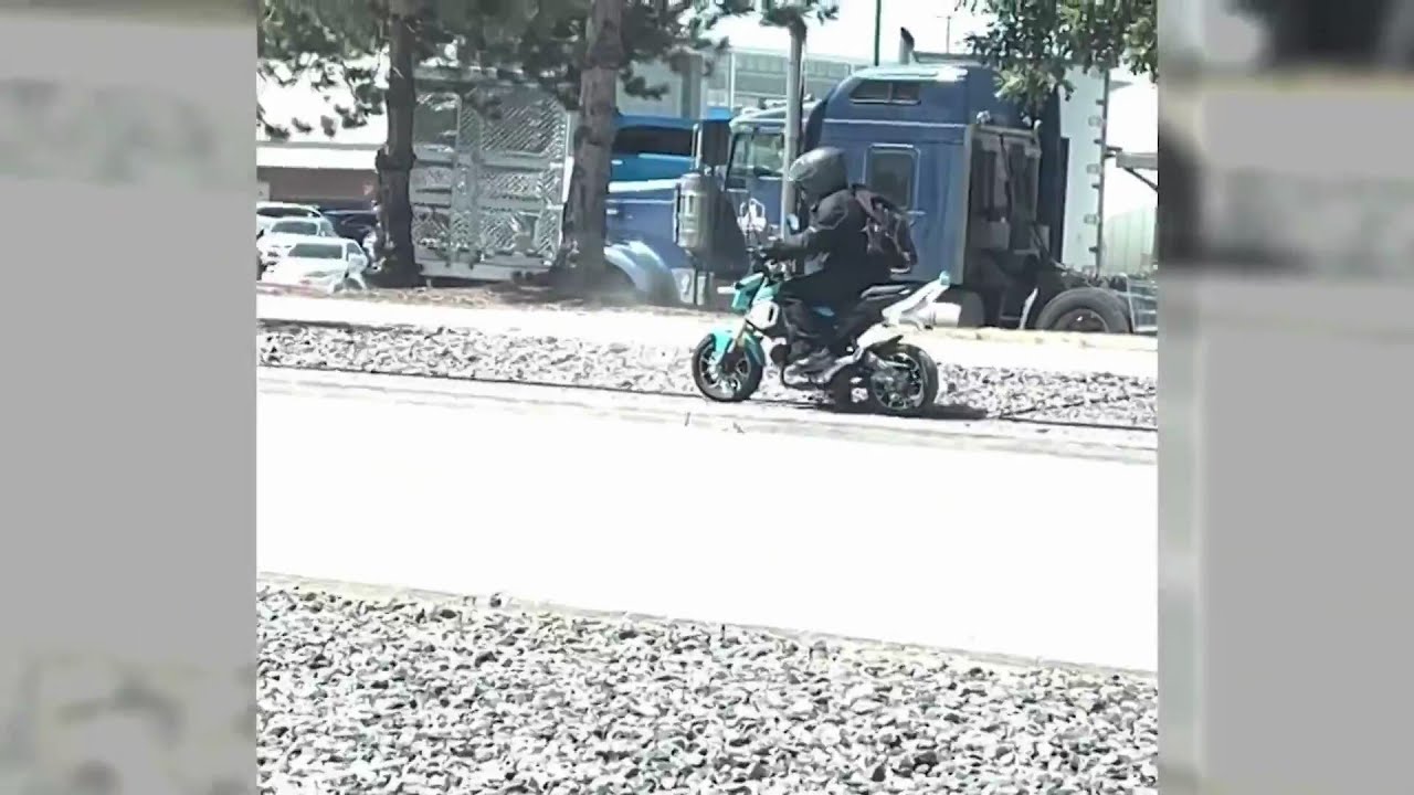 Motorcyclist smashes rock through woman's window - YouTube