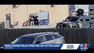 Video shows police open fire on tattoo shop