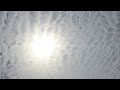 Mackerel sky with solar flare time lapse