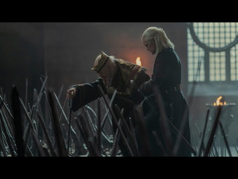 Prince Daemon help King Viserys up the stairs of the iron Throne  | House Of The Dragon.