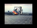 Forklift driving over the geoterra construction mat system