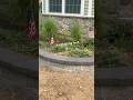 This flower bed & retaining wall combo really upped this house design 🎉