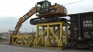 Cat 319D LN climbing onto rail car   YouTube