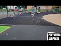 Black Wetpour With Green Fleck Installation in Wales | Wetpour Surfacing