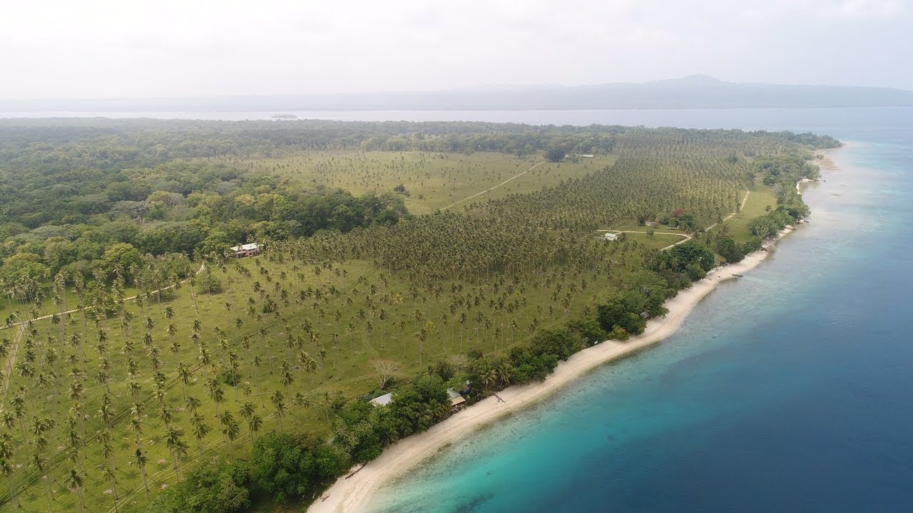 Fly over of Lapita Beach Aore Island Vanuatu.