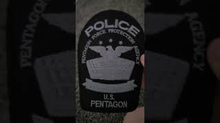 Matthew shows his police patch collection