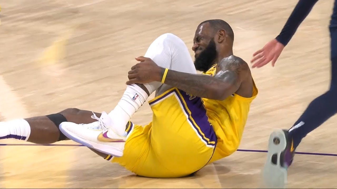 OMG! LeBron James limps off court with ankle injury after standing on a ...