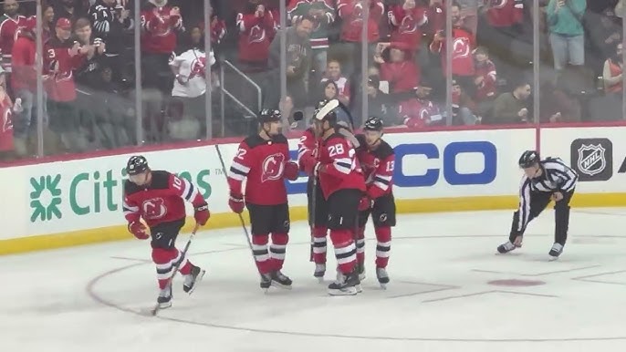 New Jersey Devils Bruce Driver reaches out to fans during a