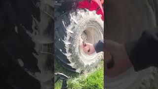 satisfying mud removal: deep cleaning muddy tractor wheels