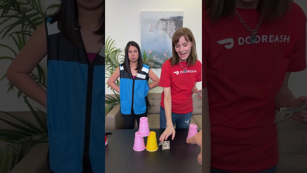 Colleagues compete in the cup stack challenge for a tip! 