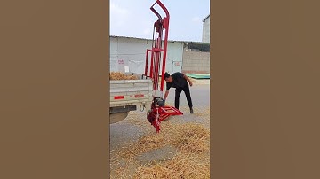 A versatile device for loading small square and round bundles of wheat straw into carts