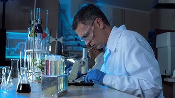 mixkit scientist working with a microscope in the lab 23618 medium