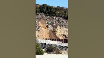 Dangerous Cleaning of Landslide on Very Steep Slope