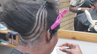 Cornrow braided updo on short natural hair