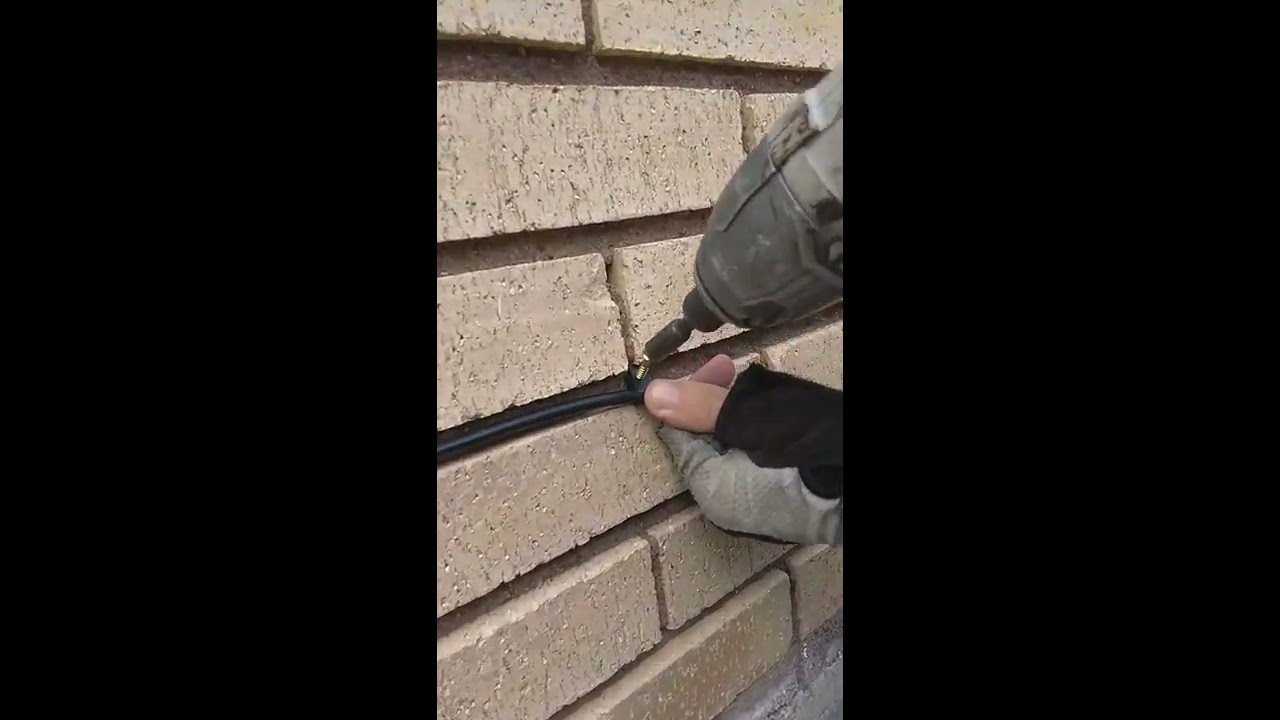 How to screw clips into brick wall.