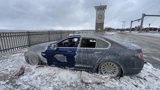 BMW covered in ice after being left along Lake Erie shoreline