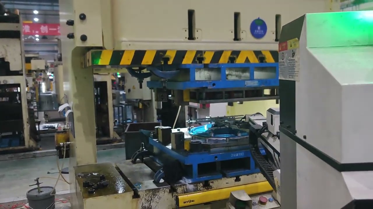 Automated stamping of washing machine part