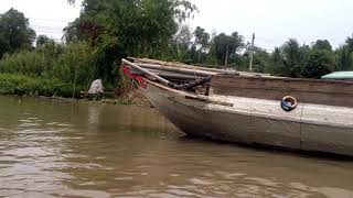 Life on the River Mekong Delta | Boat transporting rice on the Mekong River