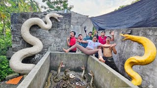 The brave soldier uses a snake detector to locate the giant python's nest.