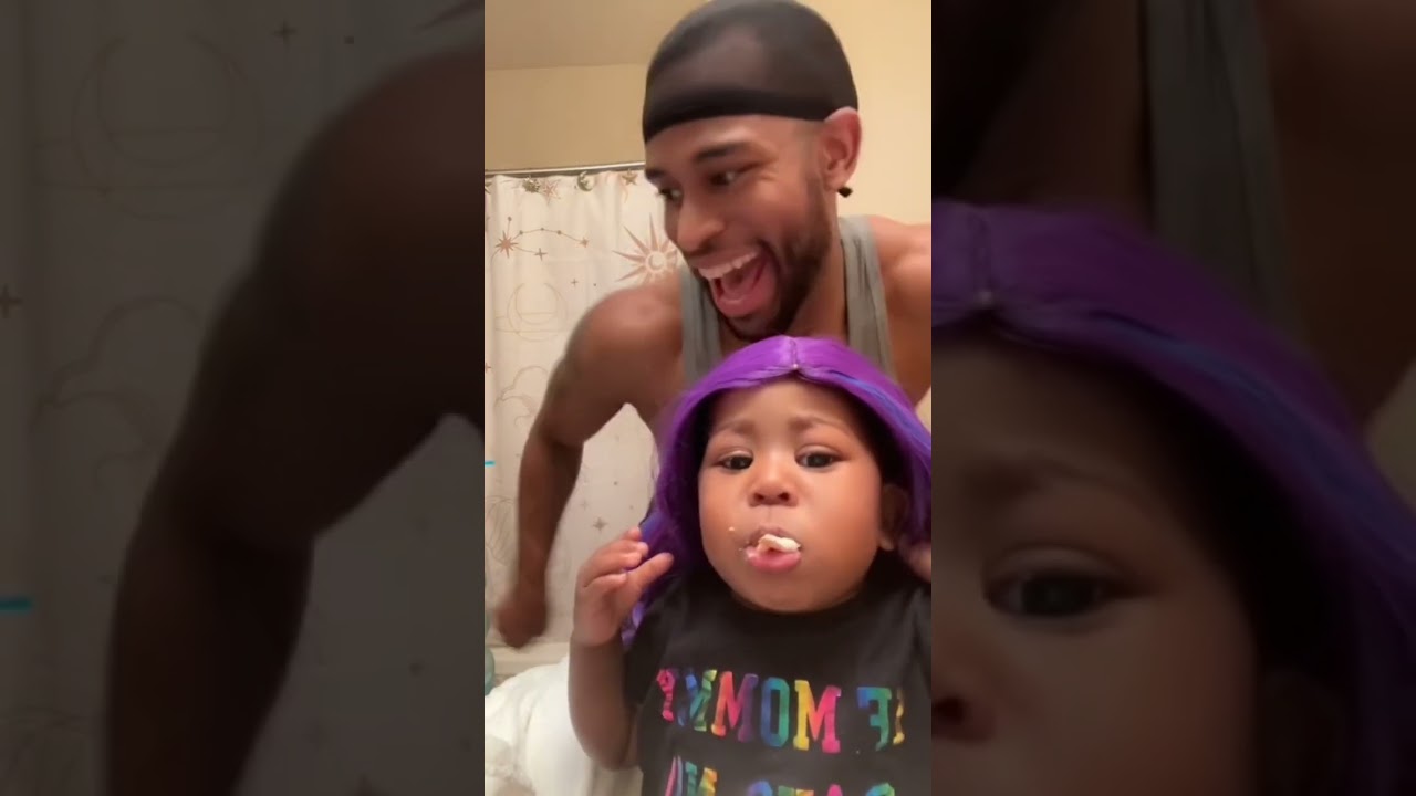 Dad installs wig on 1 year old