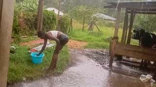 African Village Girl Bathing In The Rainrain Water