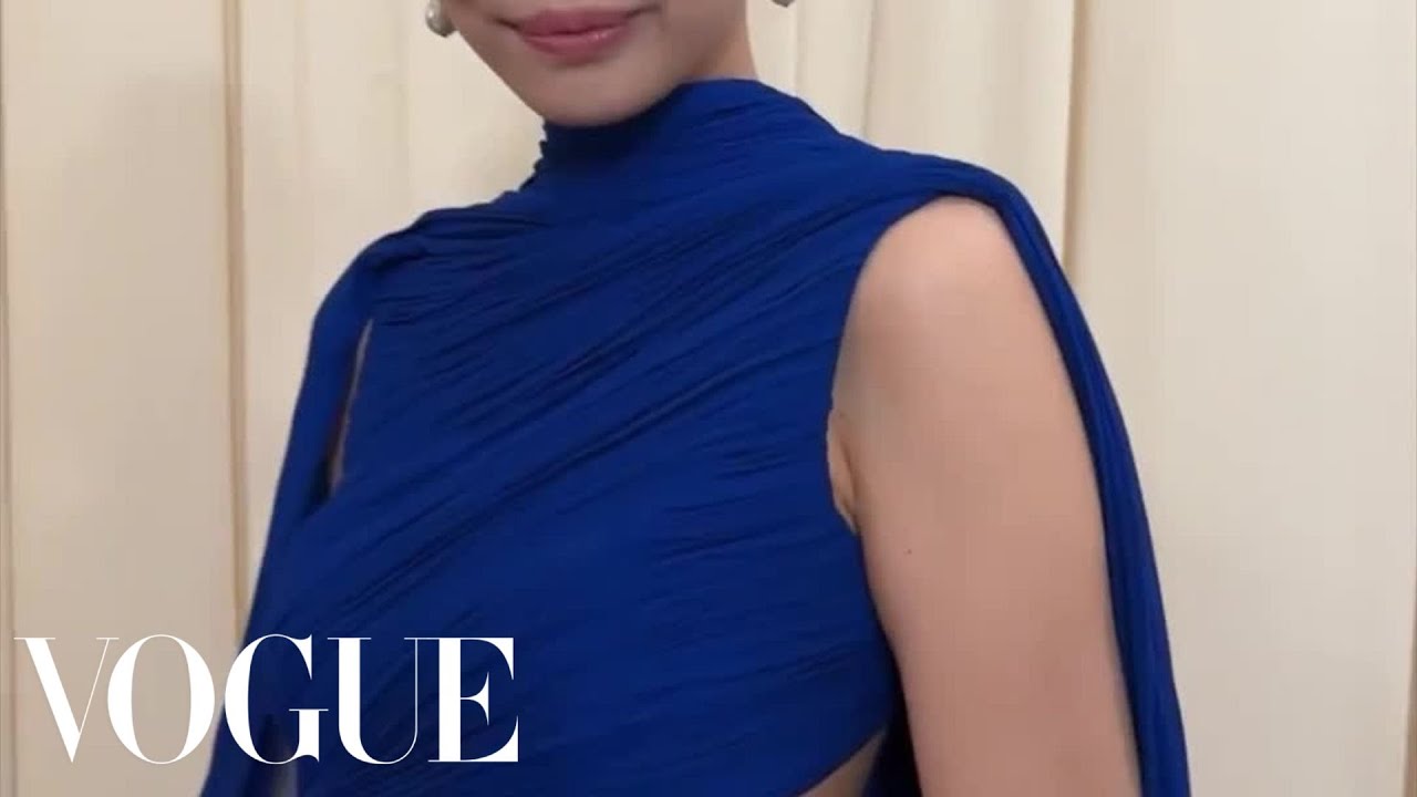 jennie met gala blue dress A gorgeous red carpet appearance from Jennie  She wears a custom blue  dress with the prettiest shimmering texture, while dangling diamond  earrings finish off the look perfectly. Photos credit: AP #zoomxmetgala #