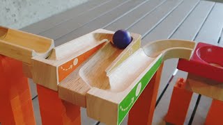 Big marble ball rolling on a wooden slope trix track
