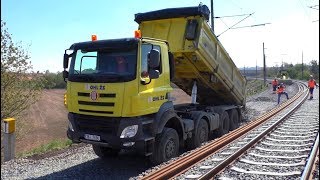 Tatra Phoenix and Mercedes Arocs on railway