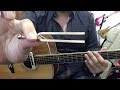 A traditional way of tuning a guitar with a pitch fork