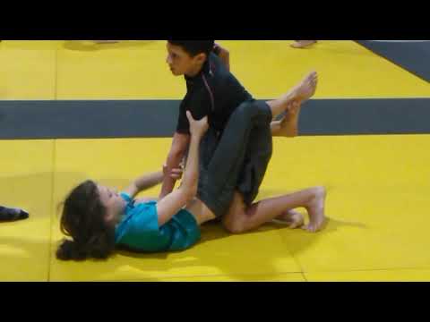 Girl wrestles boy