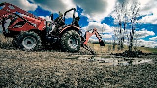 Powerful Backhoe Strapped Onto a 55hp Tractor!